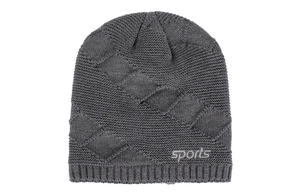 Close-up of gray knit beanie featuring textured diamond weave and sports logo embroidery