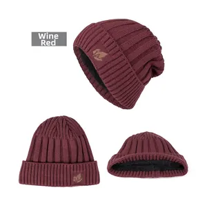 Three views of burgundy knit beanie with leaf patch and warm black fleece lining