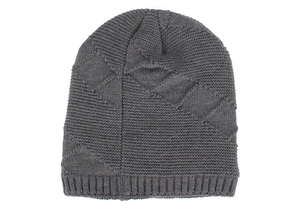 Detail view of dark grey knitted beanie featuring textured geometric diamond patterns