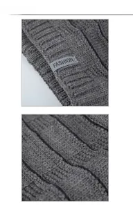 Dettaglio macro del berretto in maglia grigio scuro con trama e toppa logo moda