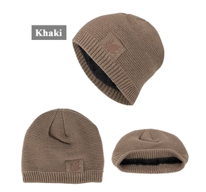Detail of khaki knit beanie featuring leather maple leaf patch and thick fleece lining