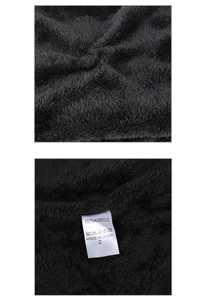 Detail showing the 100% acrylic care label on black soft fleece winter neck warmer