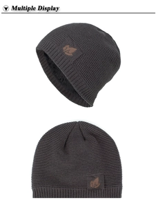Detailed views of dark grey knit beanie with fleece lining and leather leaf patch