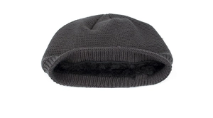 Close-up detail of dark grey knit beanie featuring warm black fleece lining and waffle texture