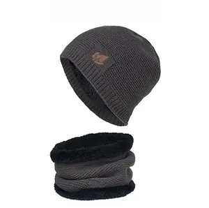 Detail of winter knit hat and neck warmer set with fleece lining and leaf patch