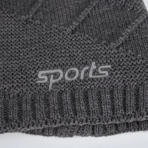 Dark grey knitted beanie featuring diamond texture and embossed sports logo