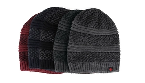 Detail of winter knit hats in burgundy, black and grey showing thick ribbed texture