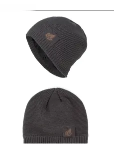 Detail view of charcoal grey knit hat showing warm fleece lining and leaf patch