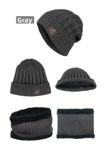 Detail of dark grey knitted beanie and scarf set with thick black faux fleece lining