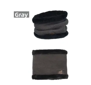 Detailed view of gray winter neck warmer with soft fleece lining and leaf embossed patch