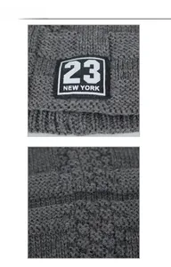 Detail der dunkelgrauen Strickmütze mit 23 New York Patch und grober Rippenstruktur