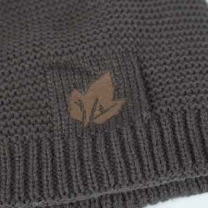 Dark grey knitted beanie featuring a brown maple leaf patch for autumn and winter outdoor wear