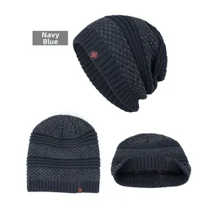 Close-up of navy blue winter beanie featuring thick fleece lining and red snowflake embroidery