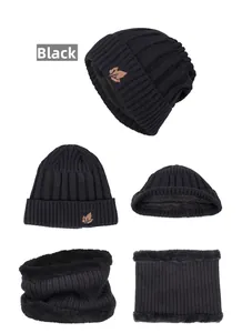 Detail view of black knit hat and neck warmer set with fleece lining and leaf patch