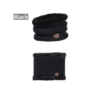 Detail of black winter neck warmer with fleece lining and maple leaf patch