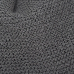 Dark gray knitted winter hat with fleece lining and leaf pattern texture detail