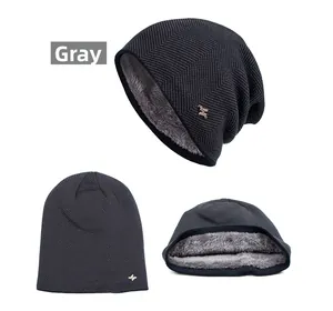 Close-up of grey knit beanie with thick fleece lining and cross metal logo