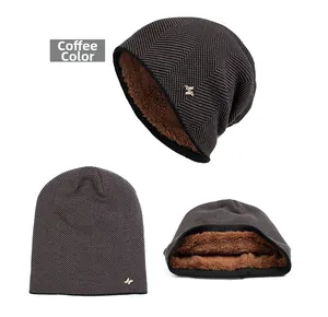 Close-up of winter knit beanie in coffee brown with thick fleece lining and metal H-logo