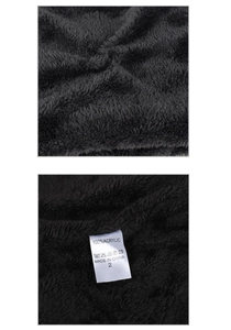 Detailed macro of the black thermal knit lining with 100% acrylic care label detail