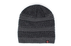 Detailed view of dark grey knit beanie with honeycomb texture and red snowflake patch