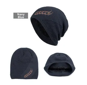 Navy blue knitted beanie with plush lining and wheat stalk embroidery detail