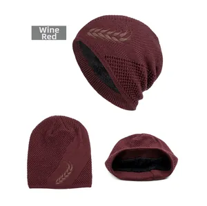 Detail of wine red knit beanie with wheat ear pattern and thick thermal fleece lining