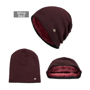 Detail of wine red winter beanie showing the thick fleece lining and knit texture