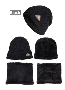 Close-up of black knit beanie and neck warmer with thick fleece lining and snowflake patch