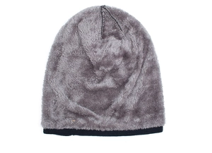 Detail view of the warm dark gray fleece lining inside a winter knitted beanie hat