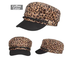 Detail view of coffee leopard print flat top hat with black brim and metal buttons