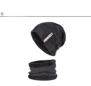 Detail of winter knit beanie and neck gaiter set with thick black fleece lining and patch