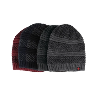Winter knit beanies in four colors with snowflake label and striped knit pattern