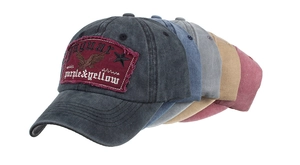 Detail view of five vintage washed cotton baseball caps with embroidered eagle patches