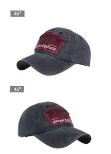 Detail view of a vintage dark grey cotton baseball cap with embroidered Jaguar patch