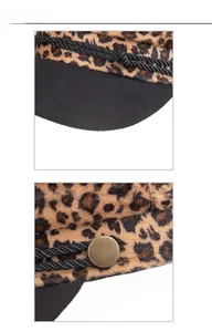 Close-up of leopard print flat cap with braided rope and metallic button detail