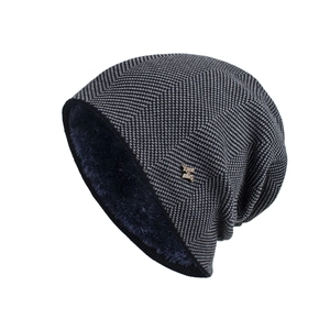 Winter fleece-lined knit beanie with metal logo and warm herringbone textured pattern