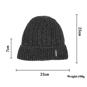Winter charcoal gray cable knit beanie hat with fleece lining and cuffed fashion label