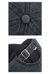 Detailed close-up of washed cotton baseball cap with retro metal buckle and stitched crown