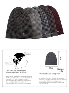 Detail view of winter beanies with houndstooth pattern and gold metal M logo decoration