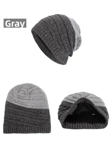 Detail of gray chenille striped knit beanie showing the warm black fleece lining texture