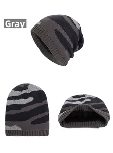 Detail of grey camouflage knit beanie showing ribbed cuff and warm black fleece lining