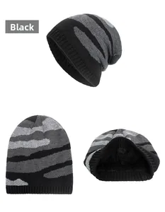 Detail view of winter knitted beanie with black camouflage stripes and thick fleece lining