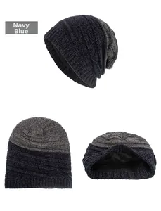 Detail of navy blue chenille knit beanie with thick gray fleece lining for winter warmth