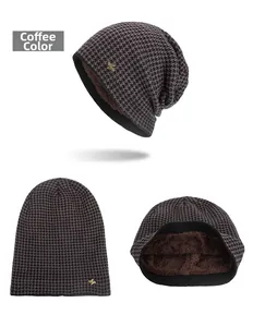Close-up of winter coffee houndstooth beanie with thick warm fleece lining and metal tag
