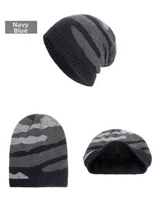 Detailed view of navy blue camo knit beanie with thick black fleece lining for winter warmth