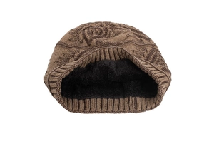 Detail of winter knitted hat showing geometric diamond texture and thick black fleece lining