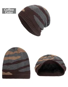 Detail view of winter knitted beanie with coffee stripe pattern and soft black fleece lining