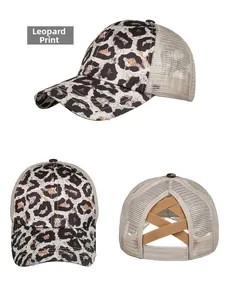 Detail view of leopard print baseball cap with elastic criss-cross ponytail opening