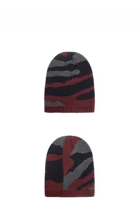 Detail of burgundy and navy camouflage knit beanie showing ribbed cuff texture