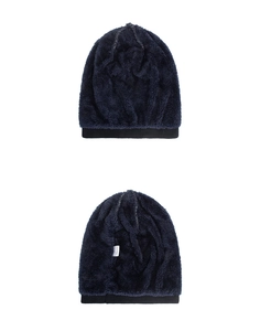 Detailed view of winter beanie featuring navy knit exterior and thick fleece lining